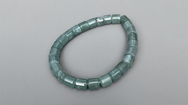 Figure 7. Guatemalan blue jadeite jade bracelet with 6 mm diameter cylindrical beads. Photo by Jennifer Stone-Sundberg; courtesy of Jade West Corp.