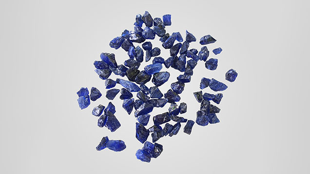 Figure 18. High-quality natural rough sapphires recently mined from the Baw Mar area, Mogok, Myanmar, ranging from approximately 5.0 × 3.5 × 4.7 mm to 17.4 × 6.6 × 5.6 mm. Photo by Arkar Moe Myint.
