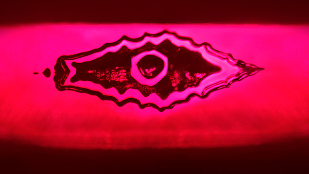The reflection of a flux-healed fissure from a step pavilion facet in this Mong Hsu ruby resembles an evil eye. Photomicrograph by Ungkhana Atikarnsakul; field of view 1.07 mm. The reflection of a flux-healed fissure from a step pavilion facet in this Mong Hsu ruby resembles an evil eye. Photomicrograph by Ungkhana Atikarnsakul; field of view 1.07 mm.