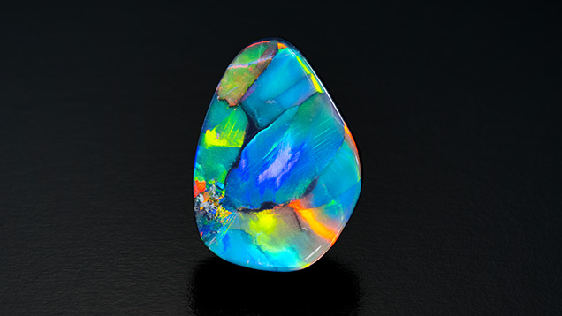 A 13.12 ct black opal from Lightning Ridge. A 13.12 ct black opal from Lightning Ridge.
