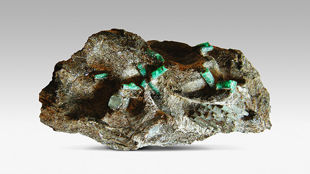 Emerald crystals from the Habachtal deposit, on a matrix of biotite Emerald crystals from the Habachtal deposit, on a matrix of biotite