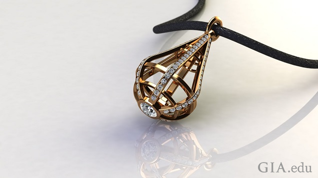 A tear-drop shaped cage of gold and diamonds hangs from a black leather cord. A tear-drop shaped cage of gold and diamonds hangs from a black leather cord.