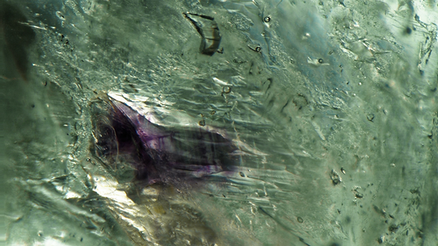 Distinct purple banding in a fluorite inclusion in emerald