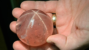 The impressive size of this museum-quality star rose quartz can be seen by comparing it to the hand that holds it. It’s part of the gem collection at the Smithsonian Institution in Washington, DC. – Eric Welch