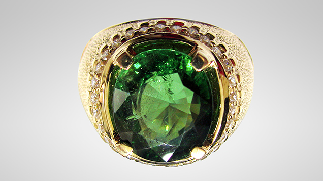 Ring containing 7.1 ct green uvite tourmaline from Luc Yen Ring containing 7.1 ct green uvite tourmaline from Luc Yen