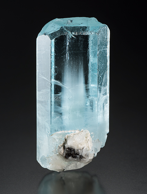 This aquamarine crystal showed iridescence as it is turned under a moving light source. This aquamarine crystal showed iridescence as it is turned under a moving light source.