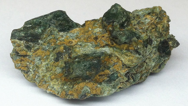 Coated lawsonite pseudomorphs coated to resemble chromian lawsonite