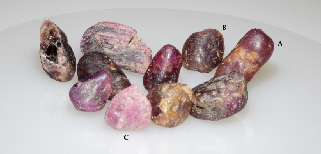 Figure 1. Ten corundum samples from the Lofa River in Weasua, Liberia. Photo by Shunsuke Nagai.