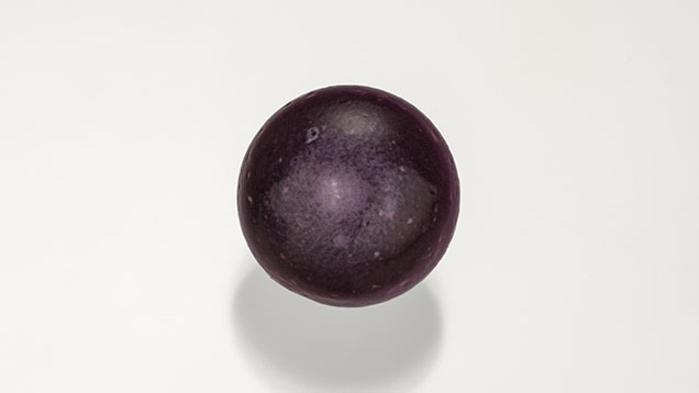 Figure 2. This non-nacreous pearl weighing 16.44 ct and measuring 14.50 × 14.36 × 11.95 mm is reportedly from a Spondylus calcifer/limbatus mollusk from the Sea of Cortez in Baja California. Photo by Robert Weldon; courtesy of ECIJA.