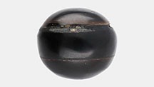 Figure 1. An assembled black non-nacreous imitation pearl weighing 10.56 ct and measuring 12.23 × 11.87 × 10.78 mm. Photo by Gaurav Bera. Figure 1. An assembled black non-nacreous imitation pearl weighing 10.56 ct and measuring 12.23 × 11.87 × 10.78 mm. Photo by Gaurav Bera.