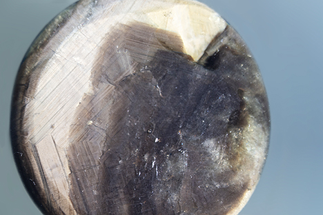 Glass filling covers a large portion of the base of the star sapphire.