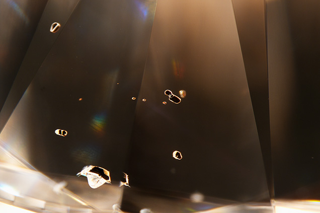 Microscopic examination reveals dark mineral inclusions
