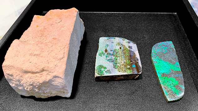 “Andamooka matrix opal” as rough, after treatment, and a finished freeform cabochon.