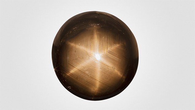 Large 75 ct black star sapphire for testing.