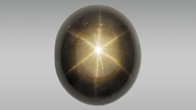 Black star sapphire enhanced with lead glass