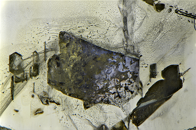 Violetish blue spinel inclusion in sapphire.