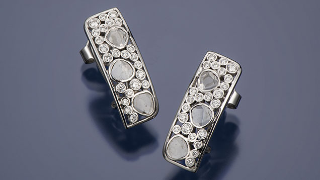 Figure 2. “Rose Cut” 18K white gold and diamond earrings. The faceted diamonds are 1.5–2.0 mm in diameter. Photo by Robert Weldon; courtesy of Sean Hill Designs.