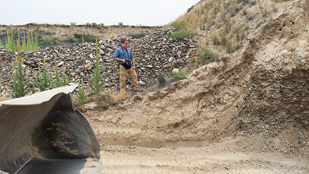 Man next to mining pit