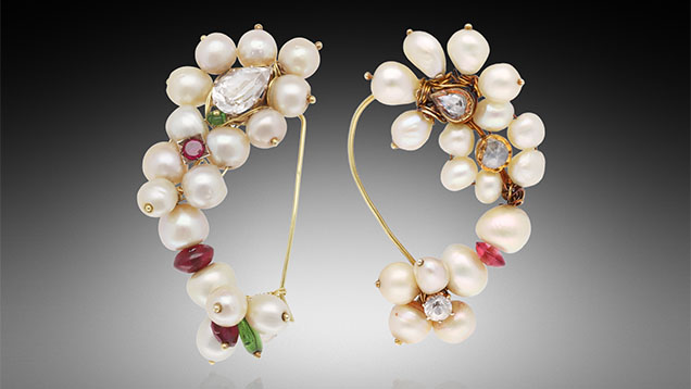 Figure 1. Two traditional Indian-style pearl nose rings (nath) set with colored gemstones and pearls measuring approximately 6.63 × 6.09 mm to 8.42 mm (left) and 5.38 mm to 8.02 × 7.61 mm (right). Photo by Gaurav Bera.