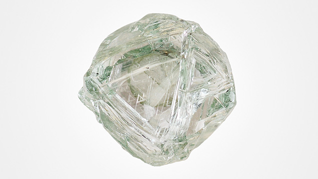 The natural “Matryoshka” diamond has resorbed points and edges as well as trigons.