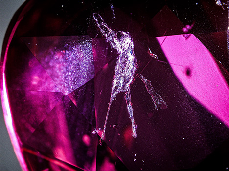 Mica inclusion in ruby resembles an extraterrestrial.