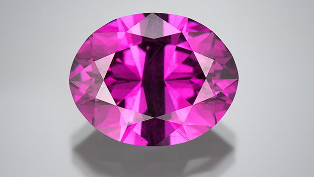 Color-change pyrope garnet cut by Victor Tuzlukov.