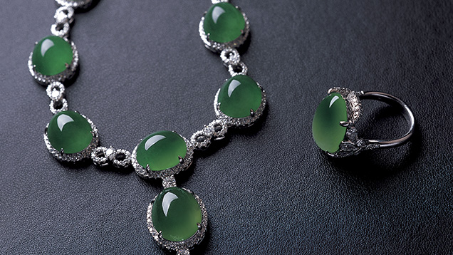 Jadeite cabochons mounted in karat gold with diamond accent stones Jadeite cabochons mounted in karat gold with diamond accent stones
