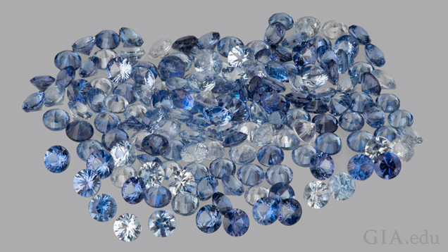A collection of faceted benitoite gemstones (approximately 5 carats total weight). Gift of Benitoite Mining Co. Photo by: Orasa Weldon/GIA.