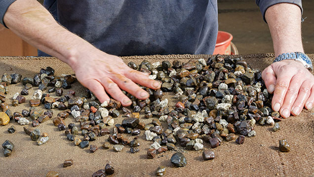 Miner picking sapphires