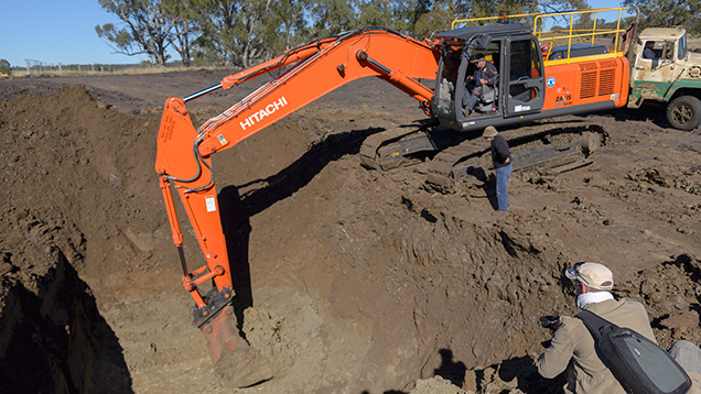 Excavator in an open-pit sapphire mine