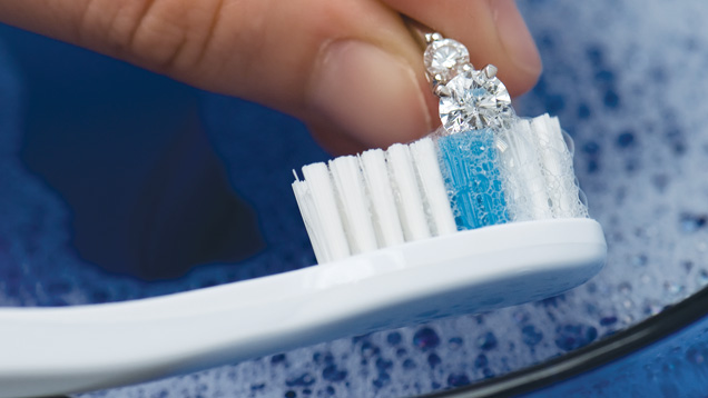 Scrubbing your jewelry with a soft, clean toothbrush helps remove leftover dirt. Just be sure not to use on jewelry that is too fragile, such as estate jewelry, to avoid any potential damage. Photo by Eric Welch/GIA Scrubbing your jewelry with a soft, clean toothbrush helps remove leftover dirt. Just be sure not to use on jewelry that is too fragile, such as estate jewelry, to avoid any potential damage. Photo by Eric Welch/GIA