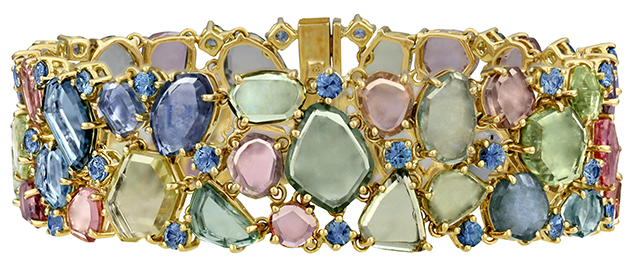 Rainbow over Montana bracelet by Paula Crevoshay.. Figure 4. Rainbow over Montana bracelet. Yellow gold and sapphires from Montana. Photo courtesy of Paula Crevoshay.