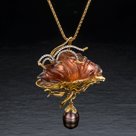 18K gold pin with sunstone, Tahitian pearl, and diamond. 18K gold pin with sunstone, Tahitian pearl, and diamond.