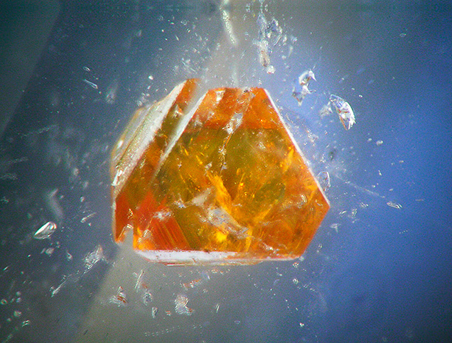 Microlite crystal in a topaz from Pakistan. Microlite crystal in a topaz from Pakistan.