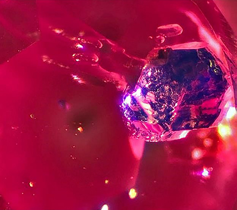 Bright blue lazurite inclusion in Mogok ruby.