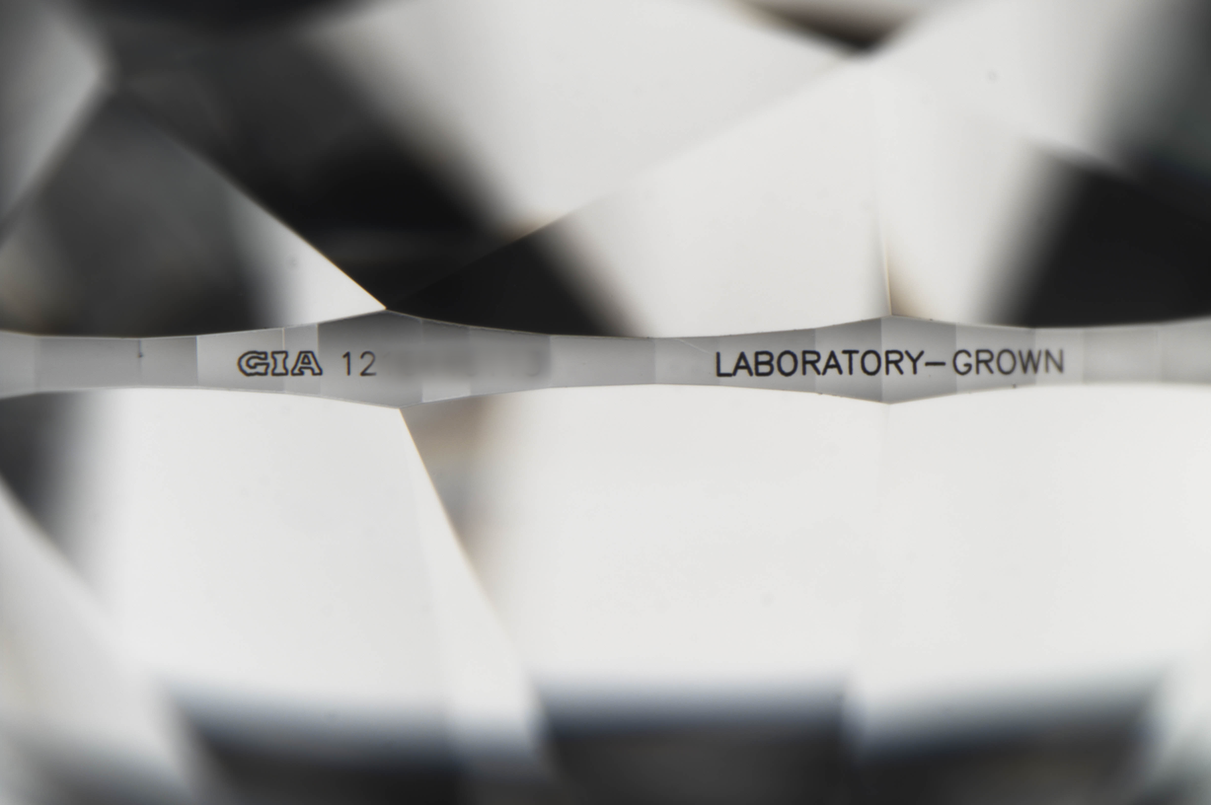 When GIA encounters a stone with a counterfeit inscription, the Institute issues a new, accurate report and inscribes the number of the new report When GIA encounters a stone with a counterfeit inscription, the Institute issues a new, accurate report and inscribes the number of the new report