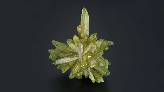 Spears of vesuvianite jut out in star-like patterns from the core.