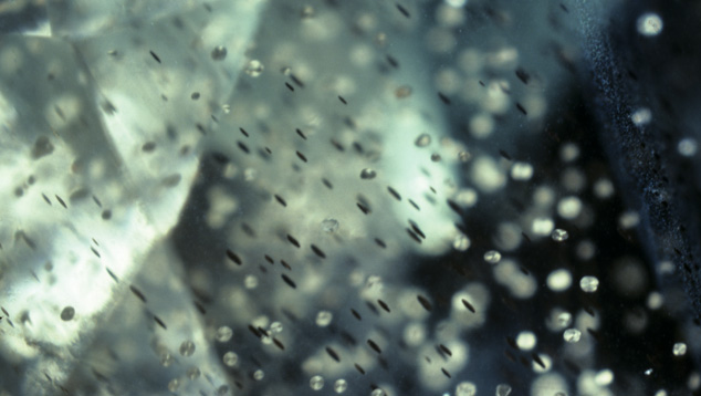 Tiny platelets in this photomicrograph are responsible for the sunstone’s aventurescence.