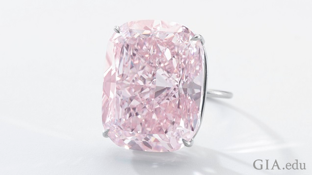 The pink diamond is a cushion-modified brilliant cut set in a ring. The pink diamond is a cushion-modified brilliant cut set in a ring.