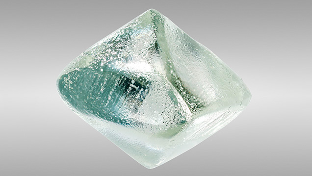 Sub-hexagonal etch pits in synthetic moissanite.