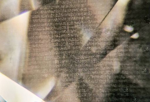 Text-Like Cloud Features in a CVD-Grown Pear-Shaped Diamond