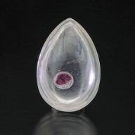 Quartz cabochon with garnet “inclusion”