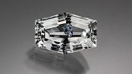 Brazilian colorless topaz with molybdenite inclusions.