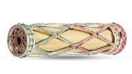 Lattice-patterned gems encase an 18K gold kaleidoscope. 