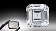 Figure 1. This 10.02 ct E-color, VS1-clarity emerald-cut diamond is an example of the great strides made in HPHT growth technology in the past two decades, as laboratory-grown diamonds have become an important sector of the gem diamond market. Photo by Johnny Leung. The as-grown CVD diamond plate (1.24 ct, 8.41 × 8.60 × 1.26 mm) was manufactured by GIA at its New Jersey research facility. Photo by Adrian Chan.